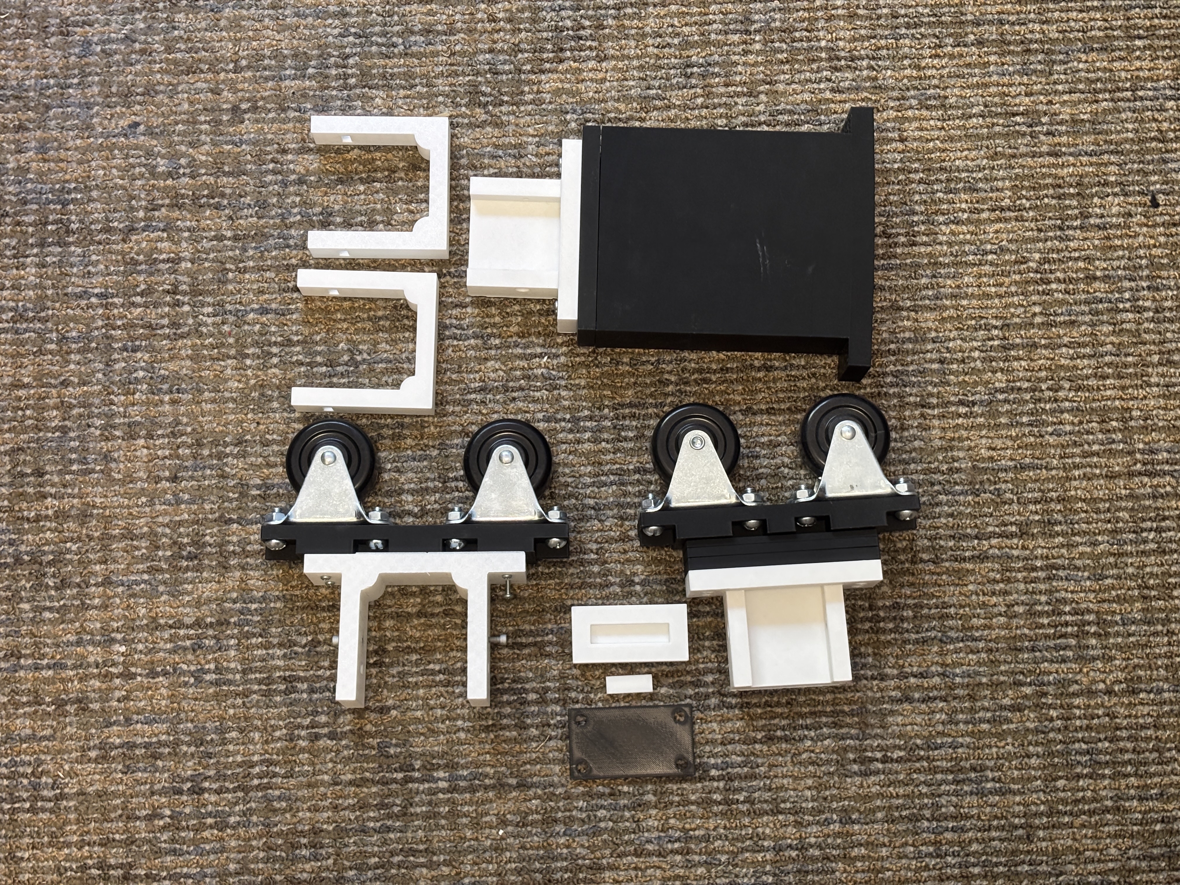 Sprout build components including wheels, gantry parts, and 3D-printed brackets