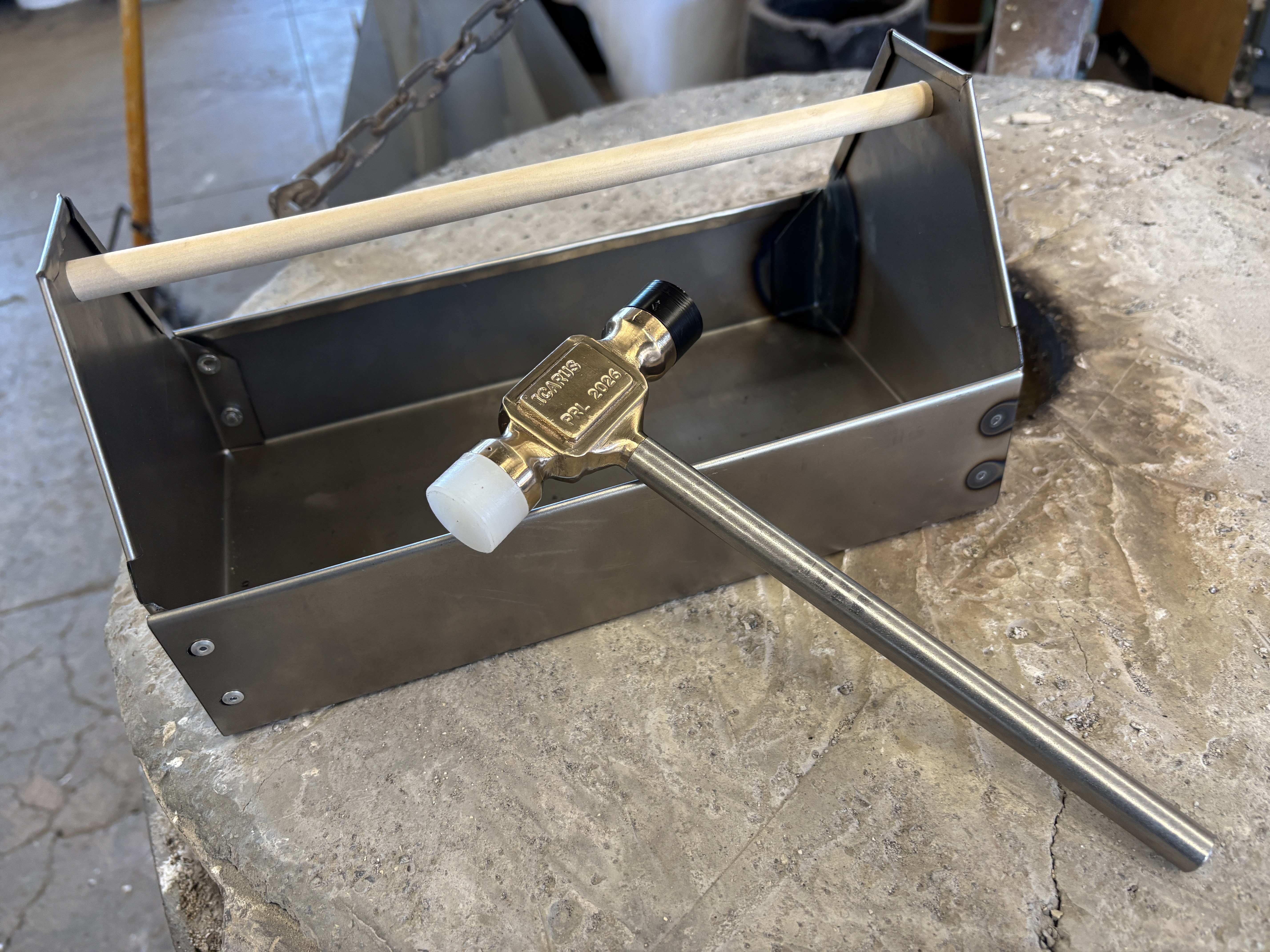 Toolbox and hammer on a workbench